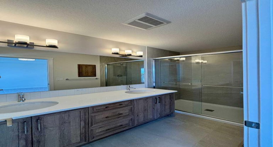 Photos are of property address Versant Rise SW, same Montay II floor plan as 695 Buffaloberry Manor. Photos are representative for layout only, colours and finishes may vary.