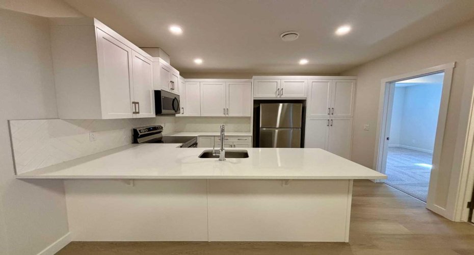 Photos are of property address Versant Rise SW, same Montay II floor plan as 695 Buffaloberry Manor. Photos are representative for layout only, colours and finishes may vary.