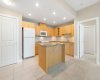 The kitchen offers granite countertops, a large centre island, and ample cabinet space—ideal for entertaining o