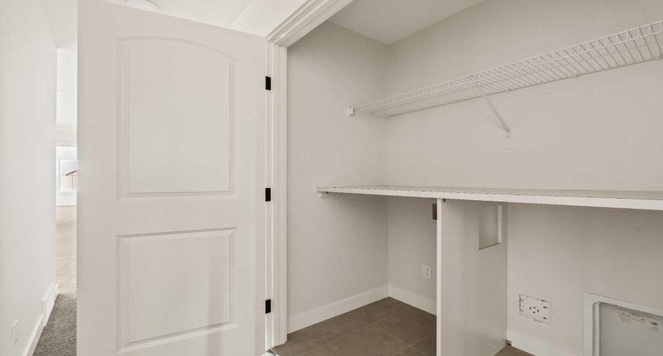 Laundry room on upper level.