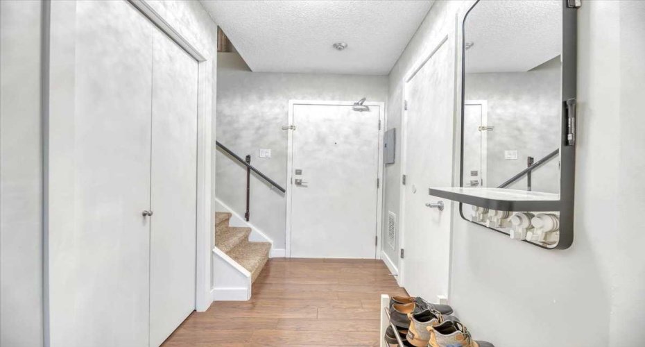 Entry space with a closet and bathroom to one side.