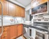 Upgraded kitchen with high quality cabinets and stainless steel appliances.