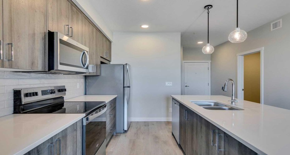 Modern sleek kitchen with luxury vinyl plank flooring