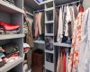 Primary bedroom walk-in closet