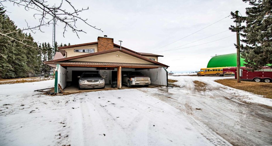 Carport  off of double attached garage.