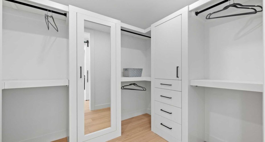large walk in closet with mirror