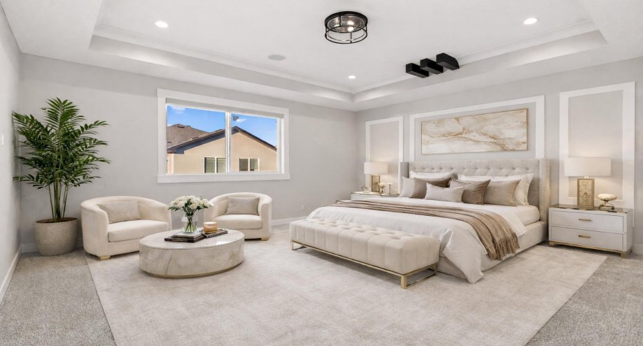 The elegant primary retreat showcases a refined feature wall and oversized window, seamlessly connected to a SPA INSPIRED 5 PIECE ENSUITE and spacious walk in closet for elevated everyday living.