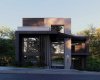 This is the Front Elevation and it makes a serious statement. The exterior features a high-contrast mix of off-white acrylic stucco and black metal cladding that looks incredible against the Bridgeland skyline.