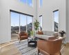 living room on main with 2 story walls filled with windows