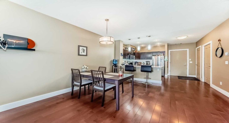 bright, open-concept floor plan with 9-foot ceilings flowing seamlessly from the front door to the private balcony.