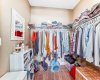 truly generous walk-in closet designed to keep your wardrobe beautifully organized.