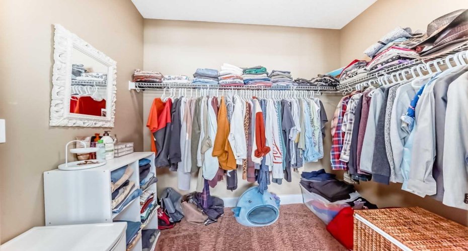 truly generous walk-in closet designed to keep your wardrobe beautifully organized.