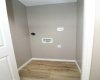 Mainfloor laundry. Primary/master bedroom.  Image from 443 Henricks Dr.