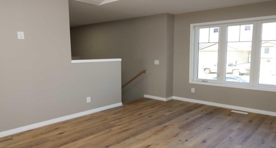Living room, heading to the basement. Bedroom.  Image from 443 Henricks Dr.