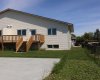 Exterior back, nice-sized deck. Has a mountain view to the west.