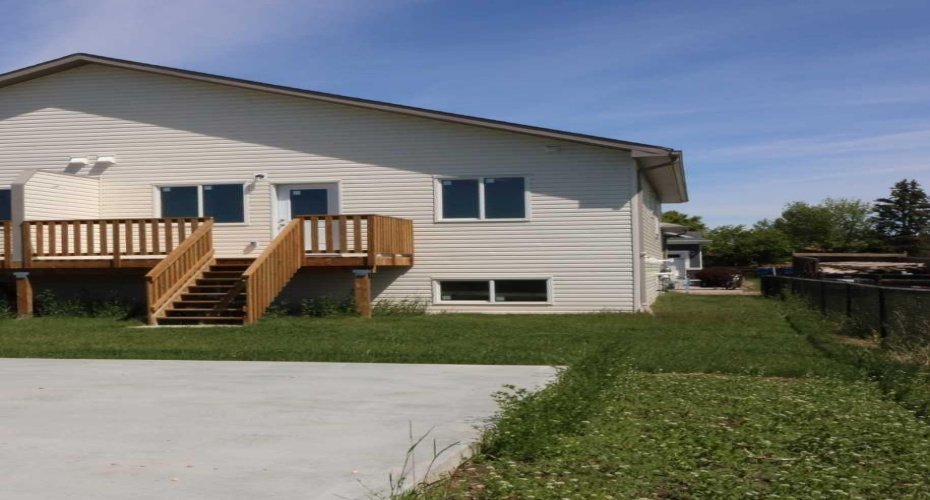 Exterior back, nice-sized deck. Has a mountain view to the west.
