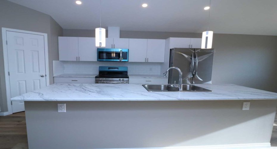 Kitchen and Island.  Image from 443 Henricks Dr.