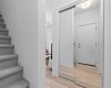 Interior entrance with large  mirrored closet