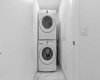 Laundry room with Stacked washer and dryer conveniently located in upper level