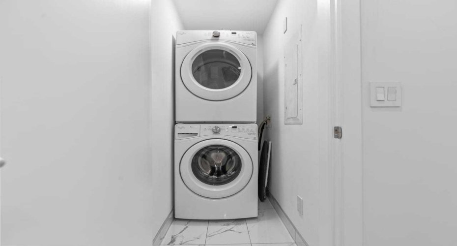 Laundry room with Stacked washer and dryer conveniently located in upper level