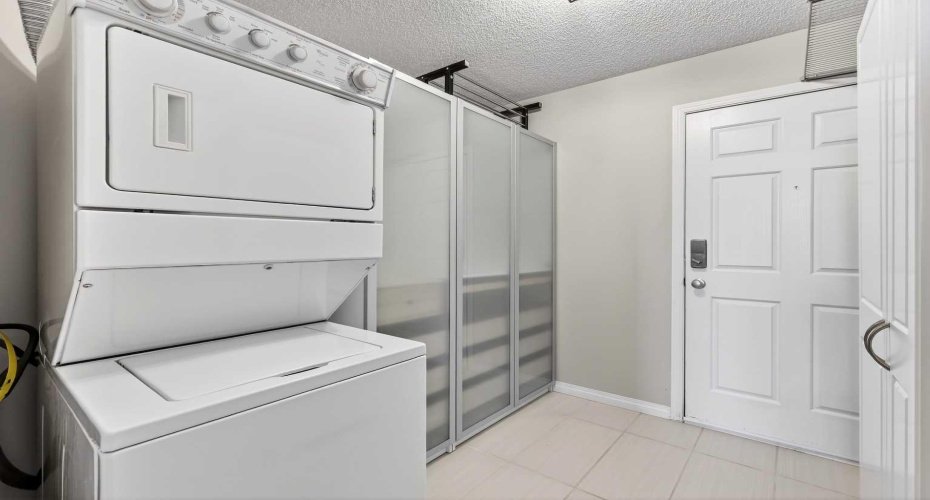 Upstairs launry in your walk-in primary closet. Note secondary entrance/exit, this one from the fourth floor.