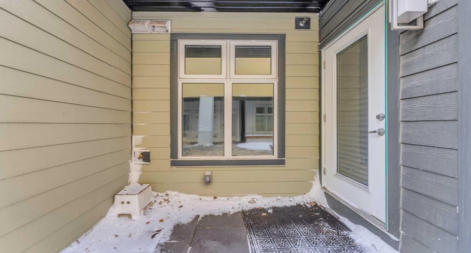 Entry to Unit via south exterior corridor