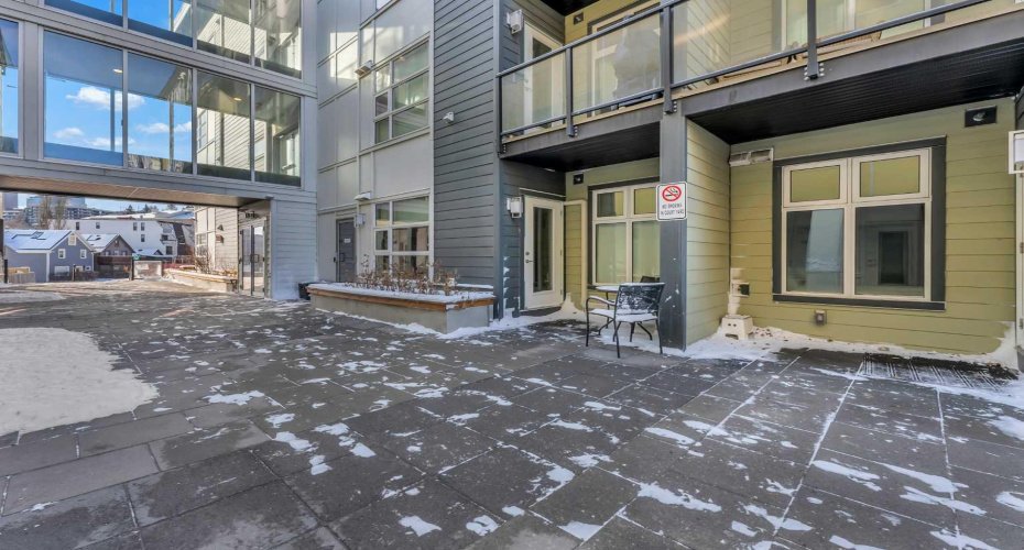 Entry to Unit via south exterior corridor