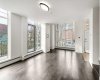 Open concept main floor with floor to ceiling windows.
