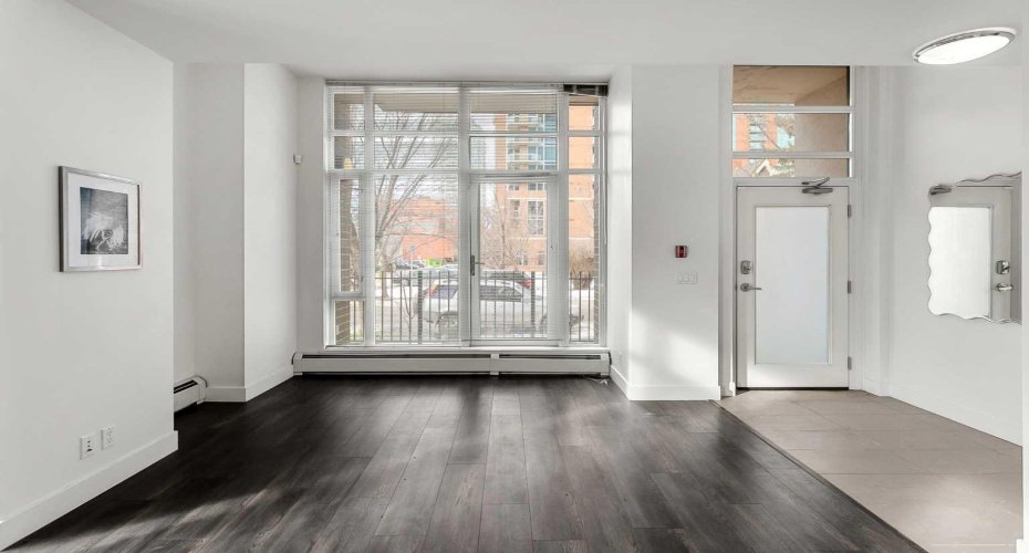 Open concept main floor with floor to ceiling windows.
