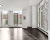 Open concept main floor with floor to ceiling windows.
