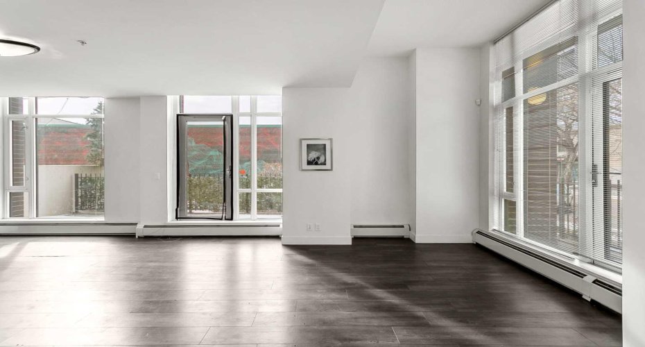 Open concept main floor with floor to ceiling windows.