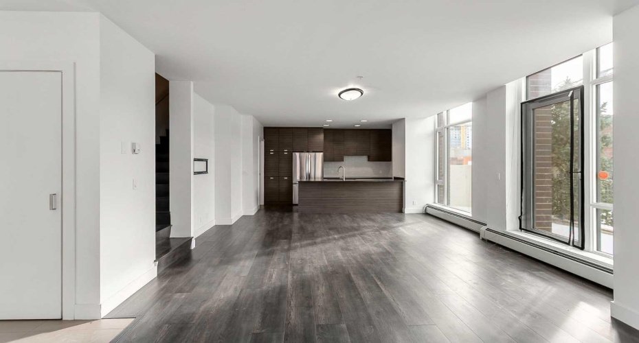 Open concept main floor with floor to ceiling windows.
