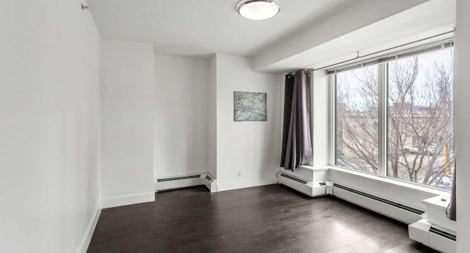Master Bedroom with a west-facing balcony, walk-in closet & 5pc ensuite.