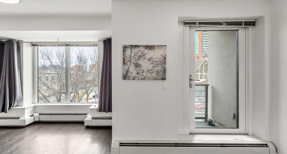 Master Bedroom with a west-facing balcony, walk-in closet & 5pc ensuite.