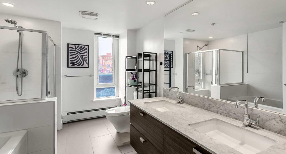 5pc ensuite features dual sinks, large soaker tub & glass surround shower.