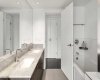 5pc ensuite features dual sinks, large soaker tub & glass surround shower.