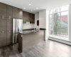 Kitchen features stainless steel appliances, quartz counters & ample cabinet space.