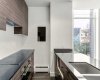 Kitchen features stainless steel appliances, quartz counters & ample cabinet space.
