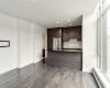 Kitchen features stainless steel appliances, quartz counters & ample cabinet space.