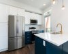 Bright and inviting, this contemporary kitchen boasts ample natural light and chic finishes, making it the heart of your home!
