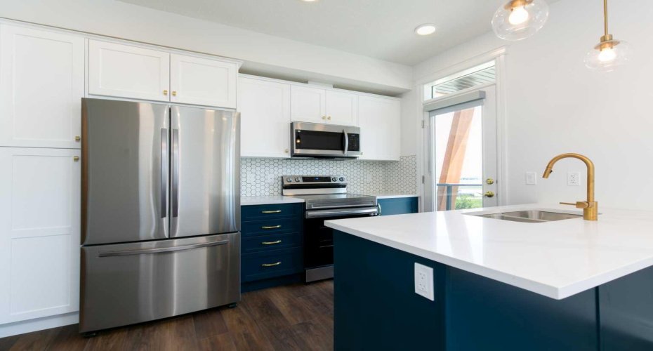 Bright and inviting, this contemporary kitchen boasts ample natural light and chic finishes, making it the heart of your home!