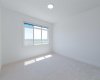 This south-facing master bedroom offers ample natural light throughout the day