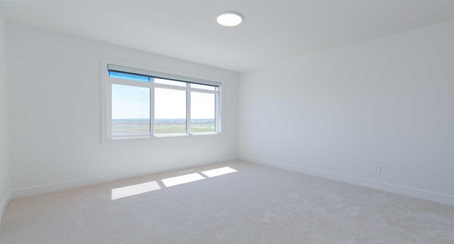 This south-facing master bedroom offers ample natural light throughout the day