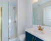 Relax and unwind in this stunning master bathroom with glass shower