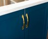 Enjoy the perfect blend of luxury with these gold and blue cabinets