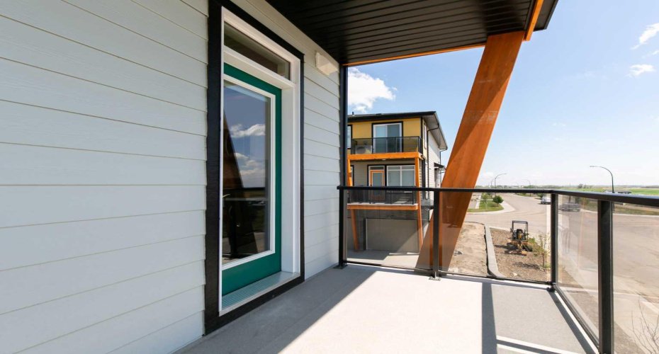 Enjoy this beautiful south-facing covered balcony, just steps from the kitchen, complete with a BBQ line, an ideal setting for unwinding after a busy day or savoring your morning coffee