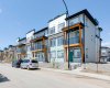 A cozy covered balcony awaits at the back of this beautiful townhouse