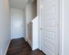 The front entrance boasts a spacious feel with soaring 9 ft ceilings and stylish laminate flooring, combining elegance with practicality