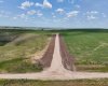 View of dirt road into the property.