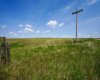 Power line leading into property and coulee vista views.